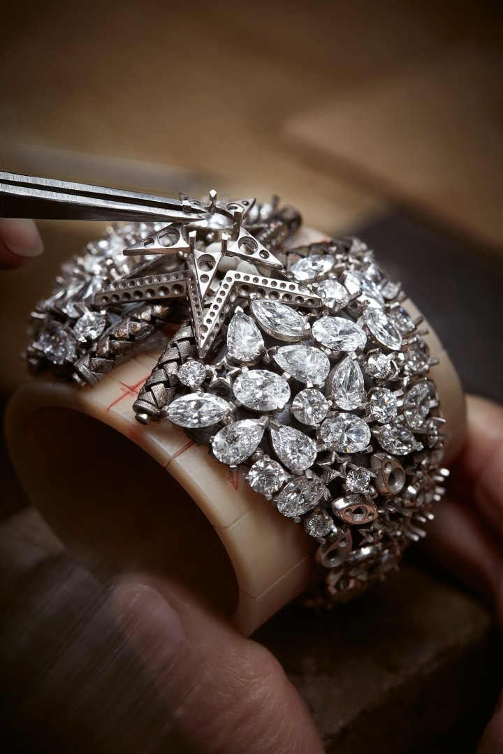 Above: in the workshops. Dreams Come True cuff in white gold, black-coated gold and natural polished diamonds. One 2.01-carat brilliant-cut diamond D-E IFVV. Below: Embrace Your Destiny ring in white gold with one 10.15-carat pear-shaped diamond D-FL.